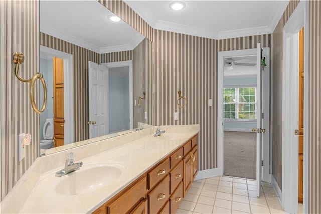 1140 Dominion Dr E, Mobile, AL 36695 - bathroom with double vanity, ornamental molding, wallpapered walls, tile patterned floors, and ceiling fan