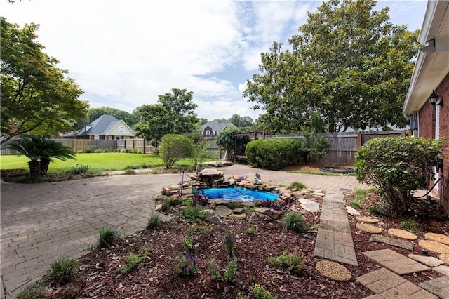 1140 Dominion Dr E, Mobile, AL 36695 - fenced backyard featuring a patio