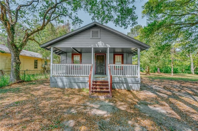 54 11th Ave, Chickasaw, AL 36611 - bungalow-style home featuring covered porch and fence