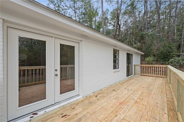 wooden deck featuring french doors