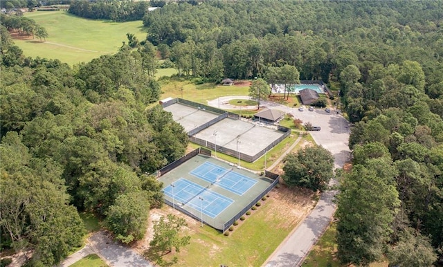 bird's eye view featuring a wooded view