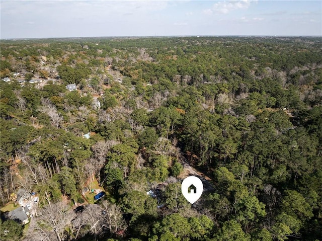 birds eye view of property with a wooded view