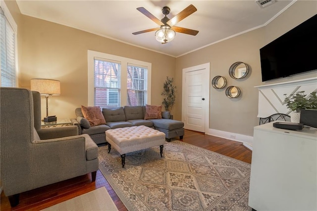 living room with hardwood / wood-style floors, ceiling fan, and ornamental molding