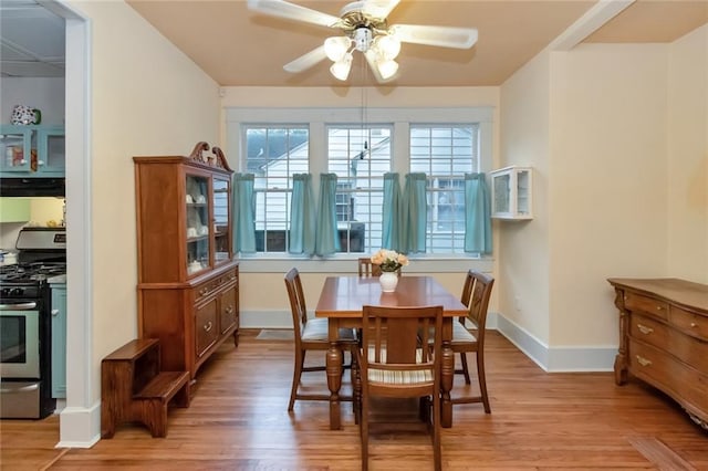 dining space featuring ceiling fan and light hardwood / wood-style floors