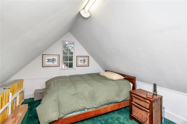 bedroom featuring dark colored carpet and vaulted ceiling