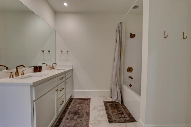 bathroom featuring vanity and shower / tub combo with curtain