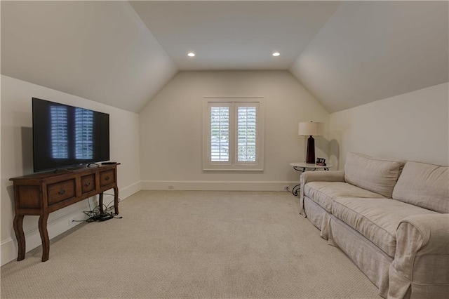 carpeted living room featuring lofted ceiling