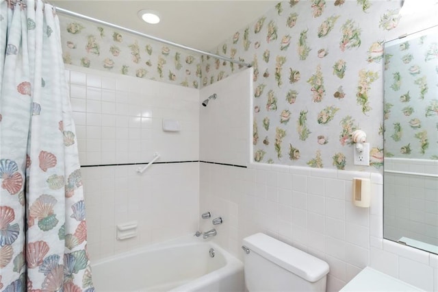 bathroom featuring toilet, shower / bath combo with shower curtain, and tile walls