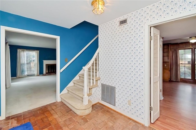 staircase with ceiling fan