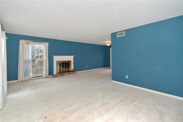 unfurnished living room featuring light colored carpet and a fireplace