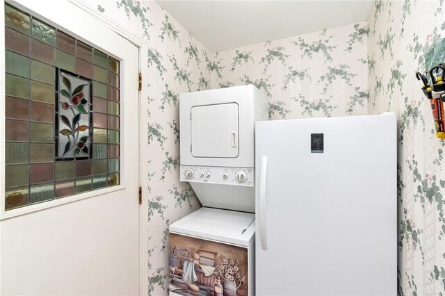 1805 Indian Creek Dr N, Mobile, AL 36607 - washroom with wallpapered walls and stacked washer / drying machine