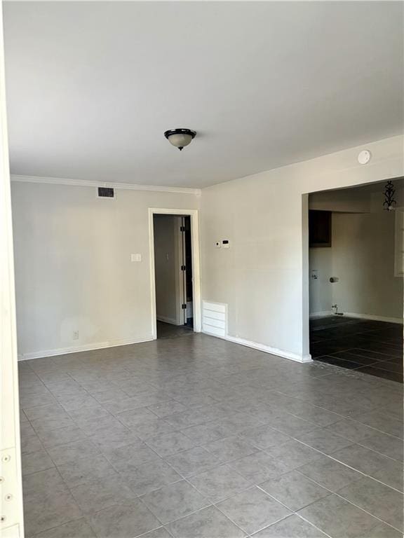 spare room with crown molding