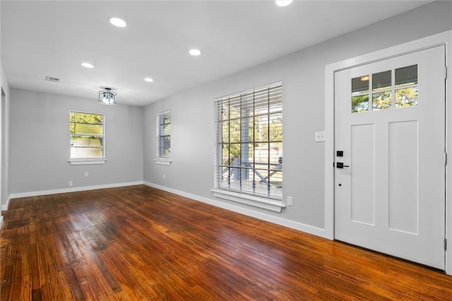 entryway featuring a healthy amount of sunlight and dark hardwood / wood-style floors