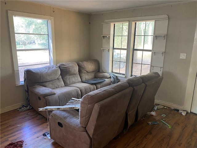 living room featuring ornamental molding, hardwood / wood-style flooring, and a wealth of natural light