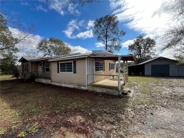 view of home's exterior with an outbuilding and a garage