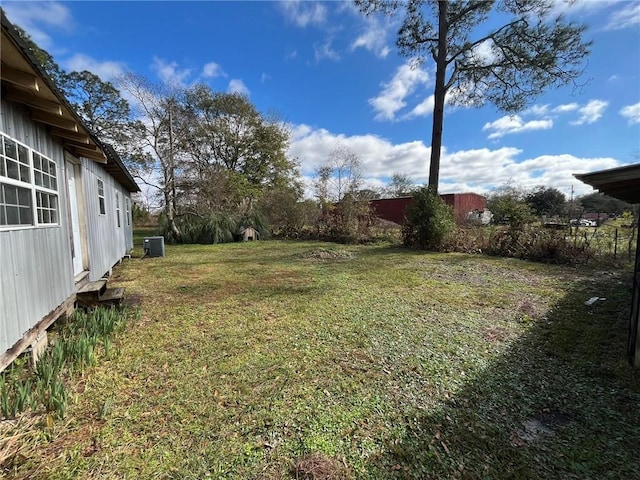 view of yard with central AC