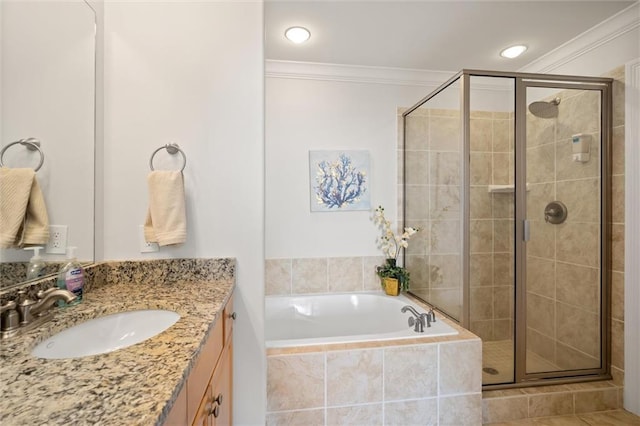 bathroom with tile patterned flooring, crown molding, separate shower and tub, and vanity