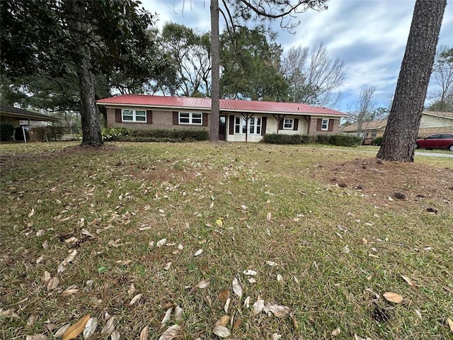 single story home with a front yard