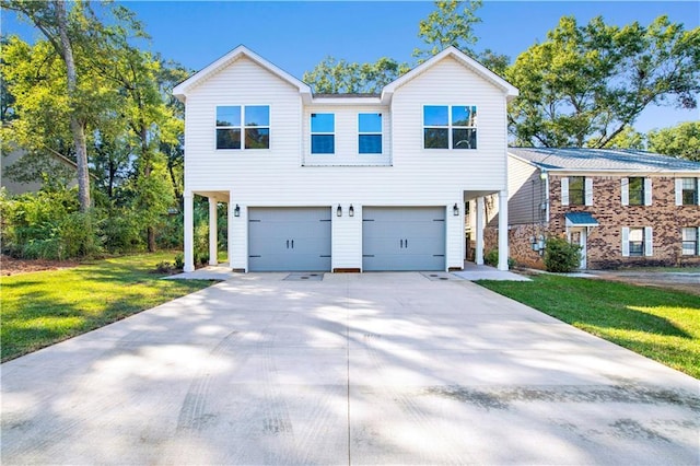 916 Mccay Ave, Mobile, AL 36609 - view of front of home featuring an attached garage, a front lawn, and concrete driveway