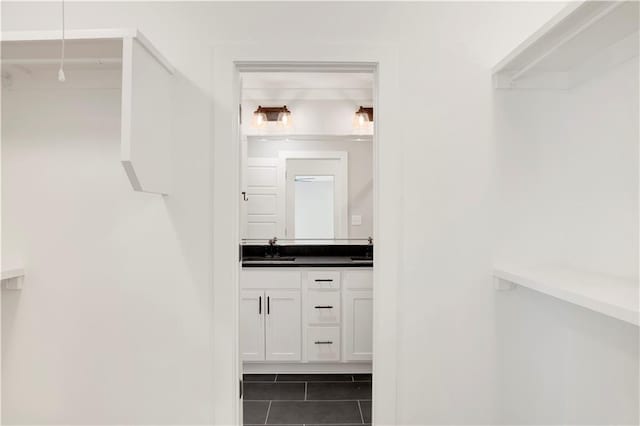 916 Mccay Ave, Mobile, AL 36609 - spacious closet with a sink and tile patterned flooring