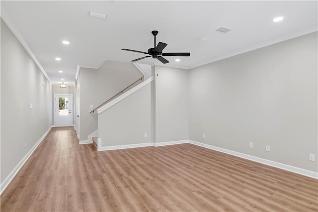 916 Mccay Ave, Mobile, AL 36609 - unfurnished living room with crown molding, light wood-style flooring, recessed lighting, a ceiling fan, and stairs