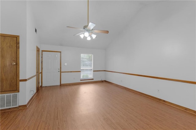 unfurnished room featuring high vaulted ceiling, light wood finished floors, visible vents, and a ceiling fan