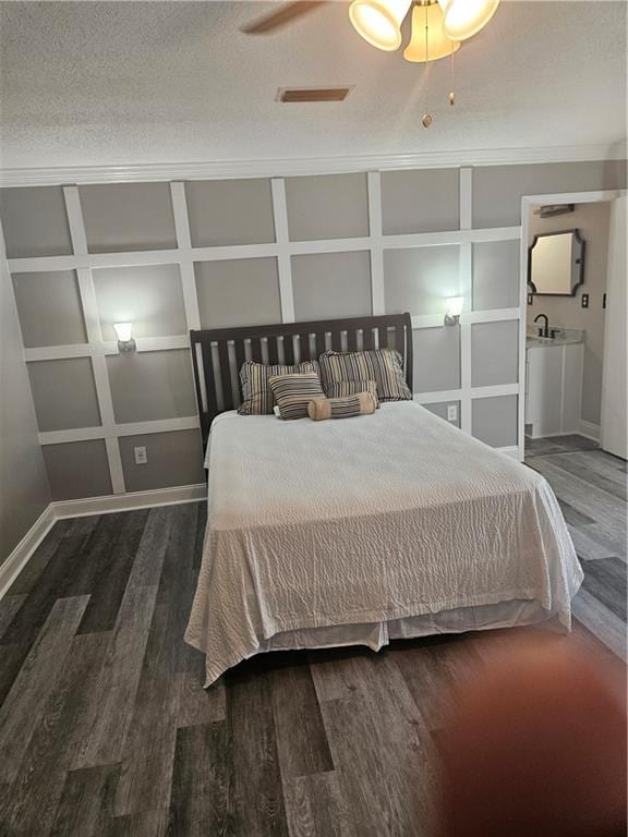 unfurnished bedroom featuring dark hardwood / wood-style floors, a textured ceiling, and ceiling fan