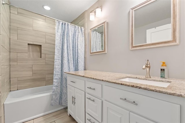 full bathroom featuring recessed lighting, shower / bath combination with curtain, vanity, and wood finished floors