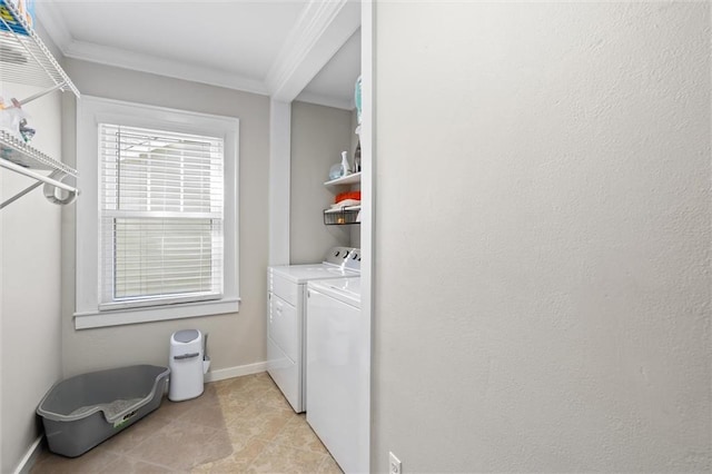 laundry room with laundry area, crown molding, baseboards, and separate washer and dryer