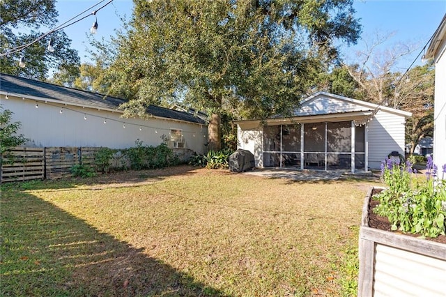 view of yard with a sunroom