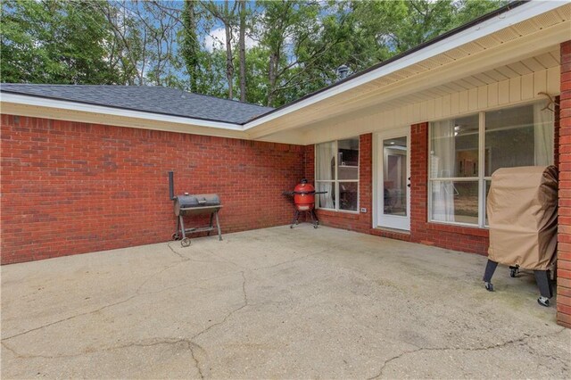 view of patio featuring a grill
