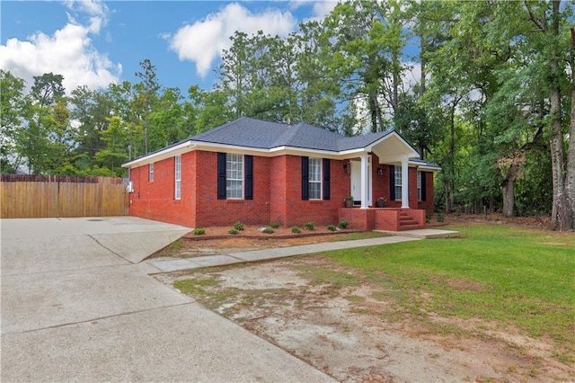 view of front of house with brick siding and concrete driveway