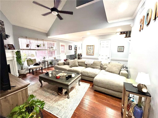 living room with hardwood / wood-style floors, high vaulted ceiling, and ceiling fan