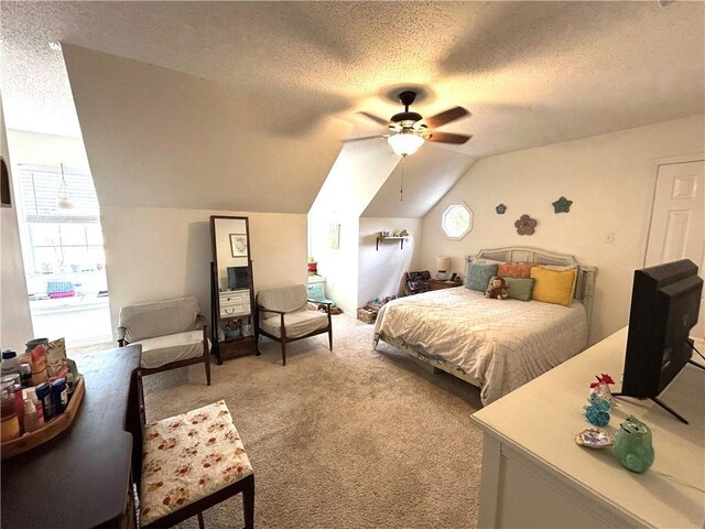 bedroom featuring multiple windows, vaulted ceiling, carpet flooring, and a textured ceiling