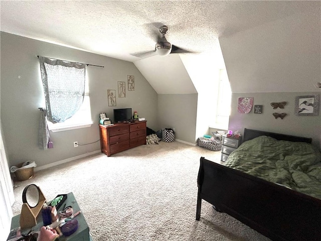 carpeted bedroom with ceiling fan, vaulted ceiling, and a textured ceiling