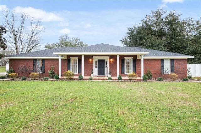 ranch-style house with brick siding, a porch, and a front yard