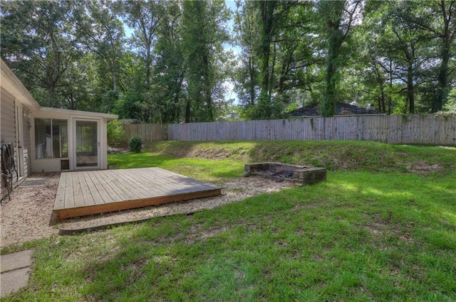 view of yard featuring a wooden deck