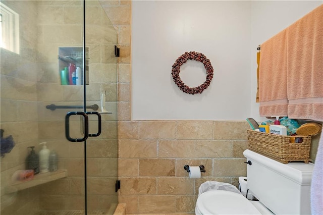 bathroom featuring walk in shower and toilet