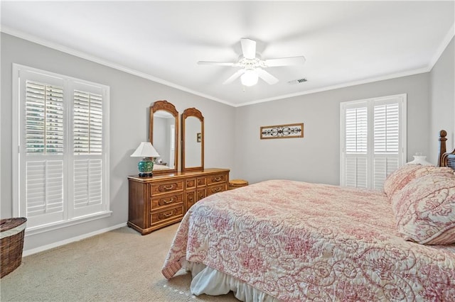 bedroom featuring ornamental molding, ceiling fan, and light colored carpet