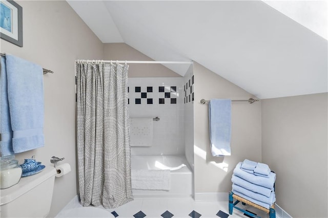 bathroom featuring shower / bathtub combination with curtain, lofted ceiling, and toilet