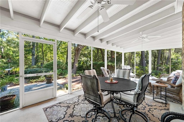 sunroom with ceiling fan and beamed ceiling