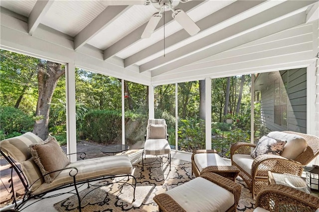 sunroom with vaulted ceiling with beams and ceiling fan