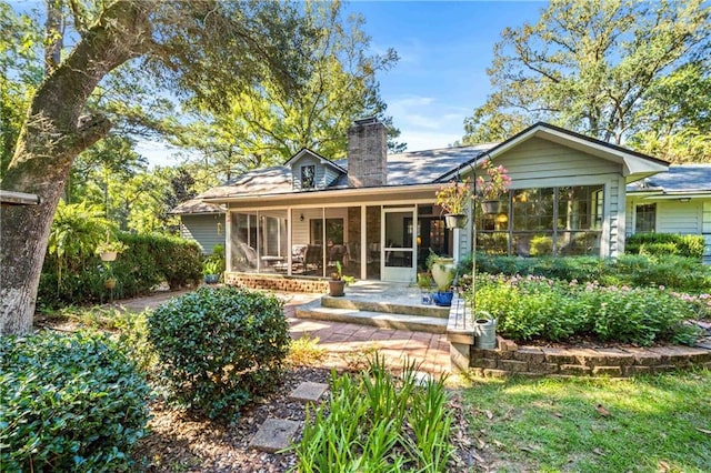 back of house featuring covered porch