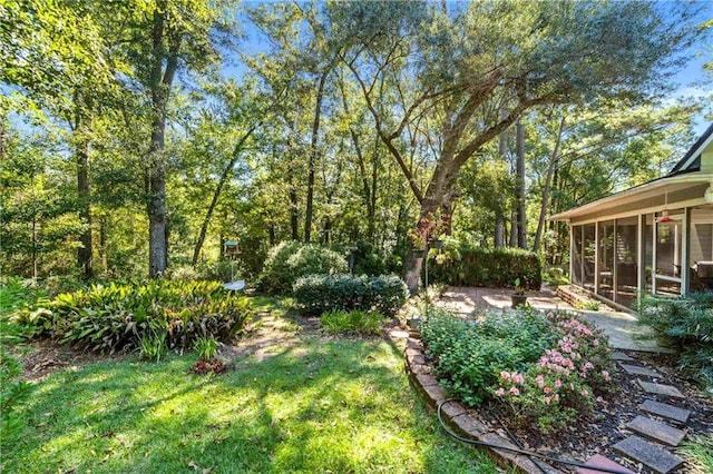 view of yard with a sunroom