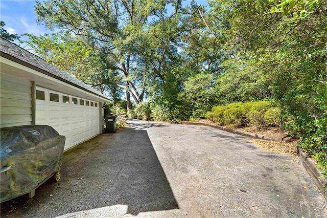 view of yard featuring a garage