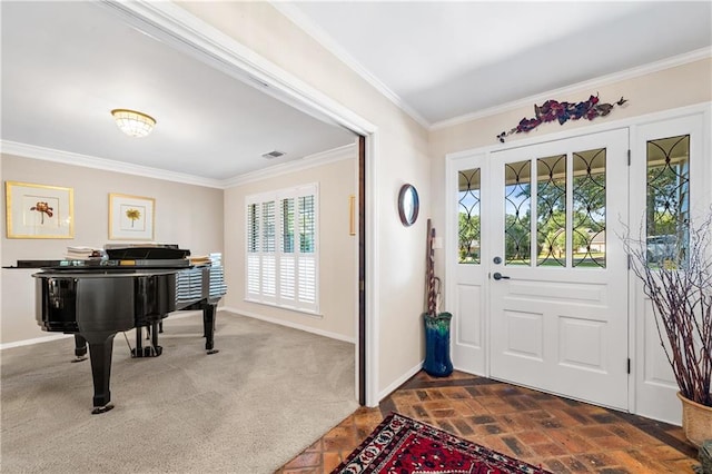 carpeted foyer entrance featuring ornamental molding