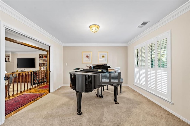 miscellaneous room with ornamental molding and light colored carpet