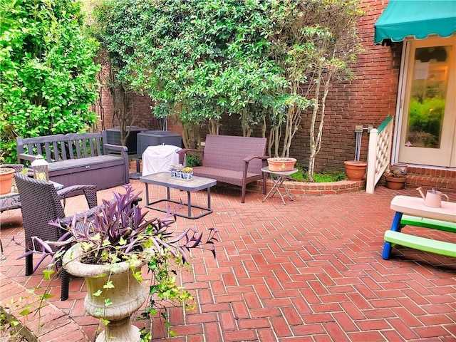 view of patio featuring an outdoor living space and entry steps