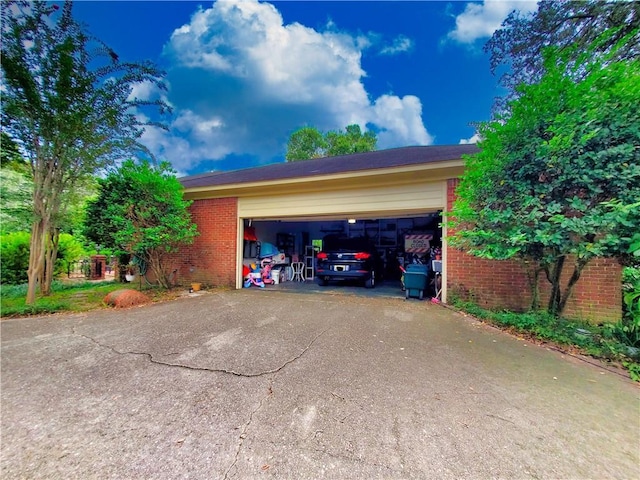 garage featuring driveway