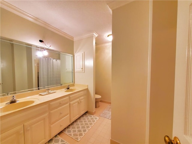 full bath with ornamental molding, toilet, double vanity, and a sink